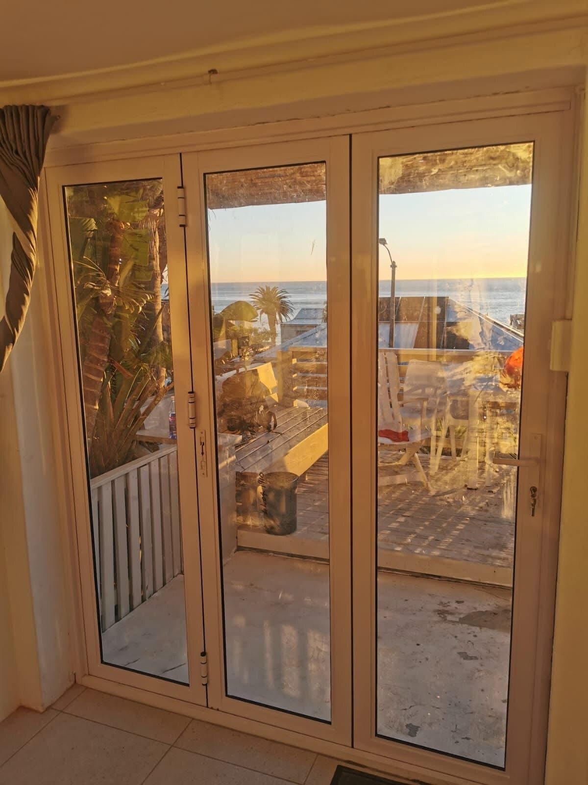 White aluminium sliding glass door