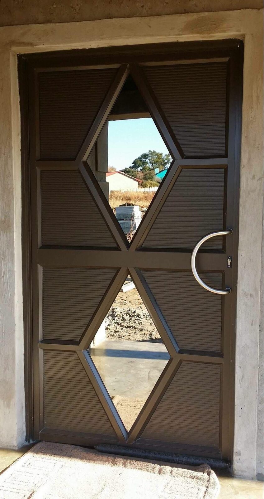 Custom aluminium entrance door with geometric glass panels