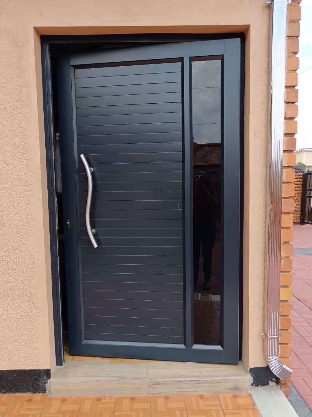 Contemporary black aluminium entrance door