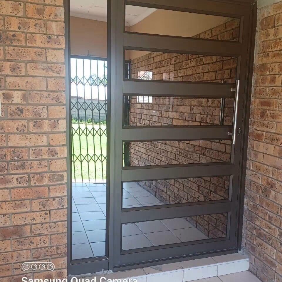 Dark aluminium security door with horizontal panels